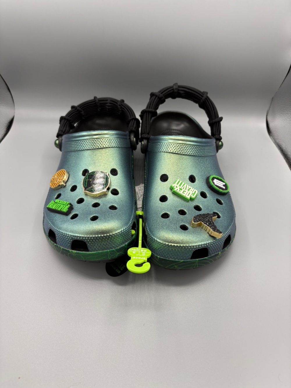 CROCS Iridescent Green Slip-On Clogs with Charms